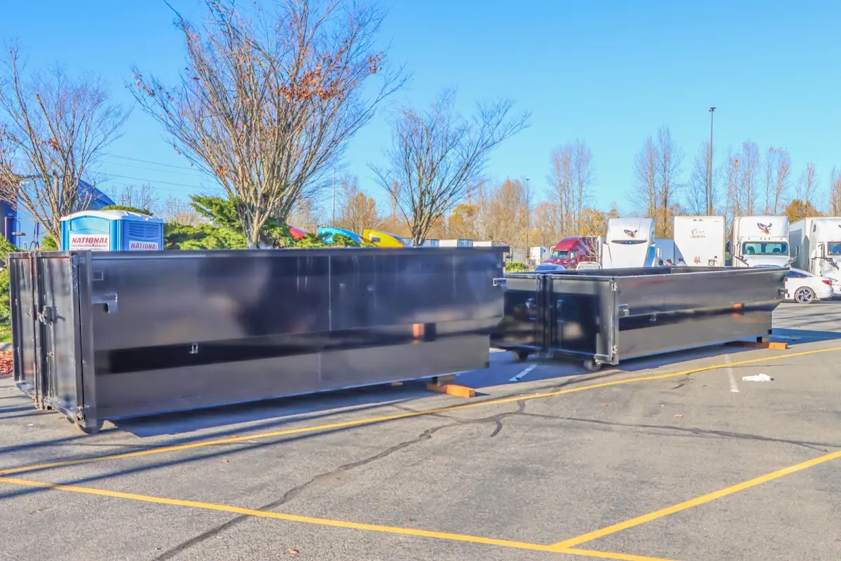 Professional dumpster rental service with roll-off container on residential driveway in Scranton